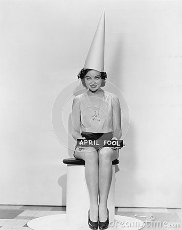 Portrait Of Woman With April Fool Sign Wearing Dunce Cap Stock ... Dunce Cap, Best April Fools, April Fool, Witchy Woman, April Fools, Bw Photo, Vintage Costumes, True Vintage, American Actress