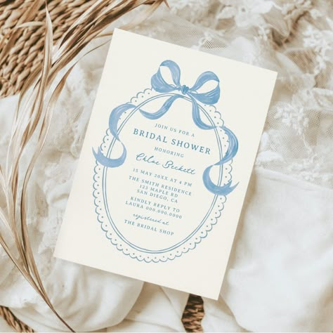 Celebrate in style with this vintage inspired bridal shower invitation featuring a dusty blue hand drawn oval frame with a bow. Something Blue Bridal Shower Ideas Centerpieces, Blue And Green Bridal Shower Ideas, Bridal Shower Ideas Blue, Something Blue Before I Do Shower Theme, Bridal Shower Themes Something Blue, Blue And White Bridal Shower Ideas, Shes Tying The Knot, Something Blue Bridal Shower Ideas, Wedding Shower Theme