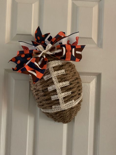 It takes about 4 1/2 packs of dollar tree rope to make this. Football Ribbon Wreath, Dollar Tree Awareness Ribbon Wreath Diy, Dollar Tree Football Wreath Form Diy, Football Wreath Diy, Football Frame, Fall Greetings, Football Wreaths, Tree Rope, Sports Wreath