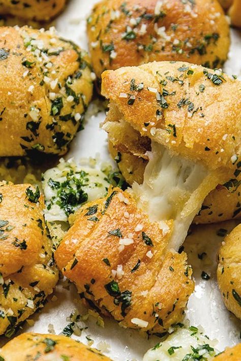 15 Unexpected Recipes You Can Make with Crescent Roll Dough #purewow #recipe #food #cooking #baking Crescent Dough Appetizers, Crescent Sheet Recipes, Crescent Roll Bread, Cheesy Garlic Knots, Crescent Dough Sheet Recipes, Crescent Roll Recipes Appetizers, Crescent Roll Dough Recipes, Bread Knots, Crescent Dough Recipes