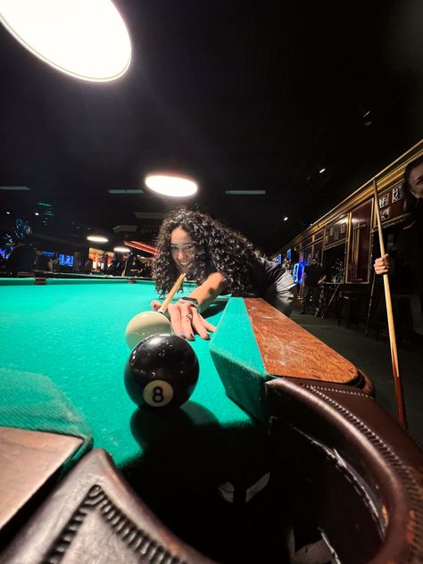 Girl shoots the eightball into the pocket of a pool table at a billiards hall Billiard Photoshoot Ideas, Recreation Aesthetic, Pool Table Picture Ideas, Pool Table Editorial, Eightball Aesthetic, Billiard Pose, Billiard Outfit Ideas, Pool 8 Ball, Billards Outfit Ideas