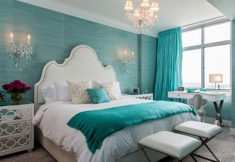 Glamorous turquoise blue bedroom boasts a white arch nailhead headboard placed against a wall covered in turquoise blue grasscloth wallpaper. Aqua Blue Bedrooms, Turquoise Blue Bedroom, Aqua Bedroom Ideas, Turquoise Bedroom Decor, Blue Bedroom Paint, Blue Bedroom Colors, Aqua Bedrooms, Colorful Bedroom Design, Turquoise Room