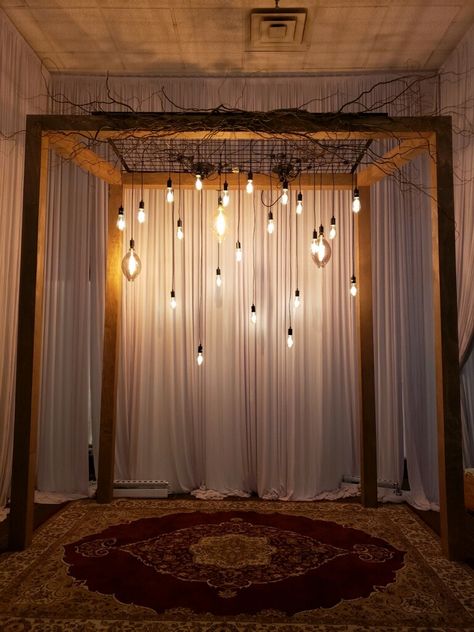 Wooden structure with varying styles of Edison bulbs Edison Lighting Wedding, Edison Bulb Wedding, Crystal Alter, Wedding Alter, Christmas Stage, Wedding Alters, Prom 2023, Light Backdrop, Wooden Arch