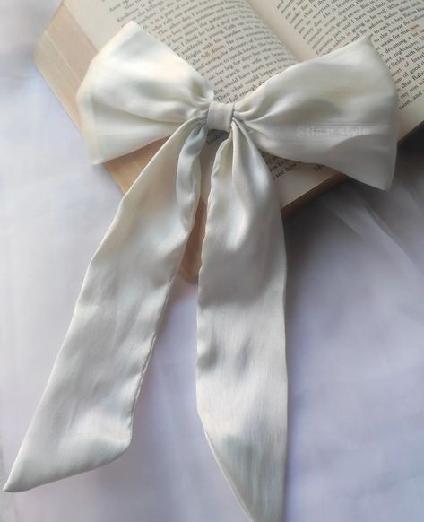 "Embrace Angelic Vibes with our White Satin Angelcore Bows. Discover ethereal elegance in every detail. #AngelcoreBows #HeavenlyChic" White Model Aesthetic, White Bow In Hair, White Elegant Aesthetic, White Bow Aesthetic, Angelic Vibes, Identity Moodboard, Aesthetic Angelcore, Bow Trend, White Hair Bow