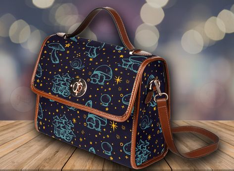 "Cottagecore Starry Mushroom Canvas Satchel bag, witchy cute snail crossbody purse, vegan leather strap hand bag goth bag, boho hippies gift >>PRODUCT INFO<< * 18.94 Oz. Made from high-grade waterproof canvas, durable, water-resistant. * Can be used as a nice laptop storage bag, business briefcase, college school bag, leisure travel tote bag, crossbody messenger bag, card wallet case, etc. * Two interior pockets for small items one zipper pocket. * Removable and adjustable shoulder strap. * The Mushroom Canvas, Goth Bag, School Bag College, Canvas Satchel, Women's Bags By Usage, Business Briefcase, Laptop Storage, Bag Business, Women's Bags By Shape