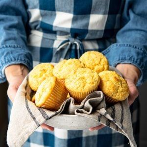 These fluffy and moist bakery-style cornbread muffins are a perfect side dish for chili, barbecue, or any other family meal. Best of all, you can stir together the batter for the sweet, tender muffins in just 10 minutes! Side Dish For Chili, Buttermilk Corn Muffins, Moist Cornbread Muffins, Cornbread With Creamed Corn, Sweet Cornbread Muffins, Creamed Corn Cornbread, Moist Cornbread, Honey Cornbread, The Seasoned Mom