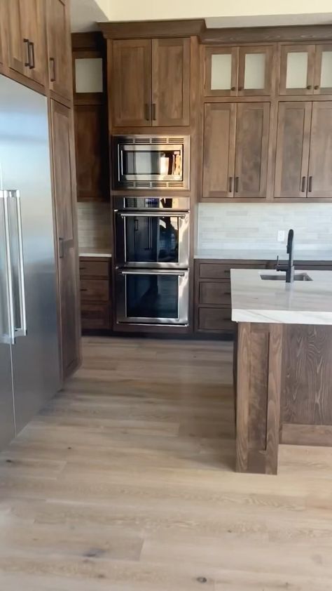 Cedar Pointe Homes | Love the color of these cabinets 🤩 • • • #customhomes #builtforyou #housetour #houseplans #modernhomes #southernutah #hometour… | Instagram Wood Stain Kitchen Cabinets Ideas, Kitchen Light Cabinets Dark Counter, Contrast Trim In Kitchen, Wood Cabinets Stainless Steel Appliances, Kitchen With Medium Brown Cabinets, Flooring To Go With Dark Wood Cabinets, Stained Alder Kitchen Cabinets, Wood Cabinet Stain Colors, Brown Cabinets Light Floors