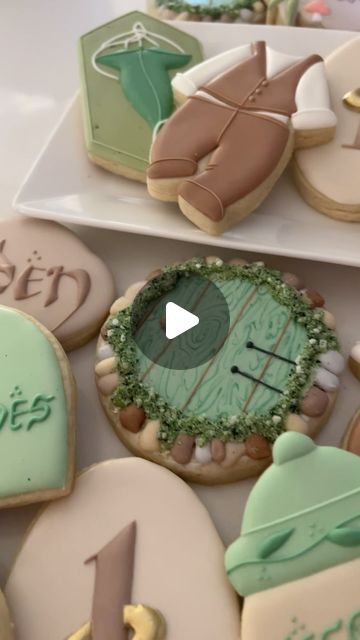 sara bogart on Instagram: "my precious 💚✨ wishing Caden all the magic for his lord of the rings inspired 1st birthday!   some cookie inspo/designs from: @kassyscookies @mixingbowlcookiecompany   #lordoftherings #decoratedcookies #royalicing" Hobbit Cookies Decorated, Hobbit Door Cookies, One Birthday To Rule Them All, Lord Of The Rings Food Ideas, Lord Of The Rings Cookies, Hobbit Cookies, Lord Of The Rings First Birthday, Tolkien Party, Small Bakery