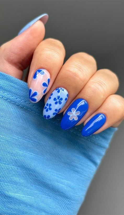 There's a new beauty trend taking over Instagram and it's absolutely stunning. Say hello to "quartz nails". Acrylic Nail Designs For Summer Almond Simple, Fun Blue Nails Designs, Blue Nails For Summer, Green And Blue Summer Nails, Blue Floral Nails Acrylic, Summer Nails Blue Flower, Blue Almond Nails With Flowers, Trendy Beach Nails, Fun Summer Nails 2024