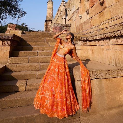 Frolicsome & Beautiful Sets By Anita Dongre For The Modern Brides! Lehenga Poses For Photoshoot, Orange Bridal Lehenga, Bridal Red Lehenga, Lehenga Shoot, Lehnga Photoshoot, Lehnga Photoshoot Poses, Lehenga Poses, Bandhani Suit, Lehenga Ideas