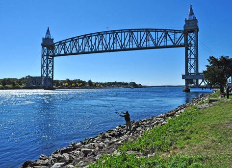 Explore the Cape Cod Canal from Buzzards Bay Recreation Area in Bourne, located at the foot of the iconic railroad bridge. Striper Fishing, Buzzards Bay, Railroad Bridge, Cape Cod Massachusetts, New England Fall, New Bedford, Buzzard, Fishing Charters, Nature Trail