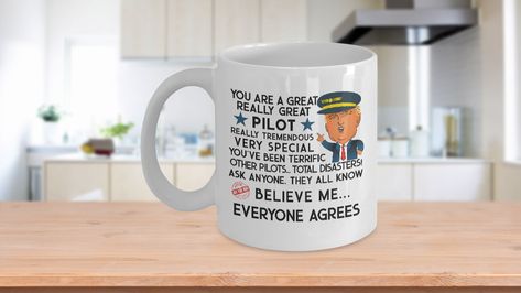 Trump Gifts Trump Mug For Pilot - Trump Wearing Pilot Hat 🛬 Unique Airplane Pilot Gift For Dad From Daughter 🛬 Pilot School Female Pilot Gift For Him Commercial Pilot Gift 🛬 Fathers Day Gifts For Men Gifts For Him🛬 SUPER HIGH QUALITY 11oz or 15oz CERAMIC MUG ~ Safe for intensely hot or cold beverages.🛬 BRIGHT COLORED PRINT ON BOTH SIDES ~ Print that lasts a lifetime to enjoy longer use for a cup of coffee.🛬 MICROWAVE AND DISHWASHER SAFE ~ Long lasting coffee gift mug is totally safe when h Pilot School, Gift For Dad From Daughter, Pilot Hat, Commercial Pilot, Airplane Pilot, Female Pilot, Pilot Gifts, Coffee Gift, Men Gifts