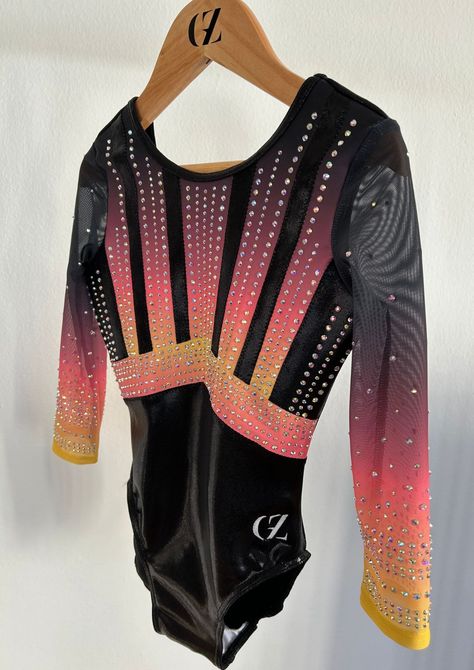 Discover Mira, the beautiful lined leotard full of rhinestones for a strong shiny look. The leotard is made of black mystic fabric, and mat sublimated lycra. The sleeves are made of mesh for an elegant look. Preppy Gymnastics Leotards, Gymnastics Vibes, Gymnast Leotards, Long Sleeve Gymnastics Leotards, Gymnastics Apparel, Black Mystic, Leotards Gymnastics, Gymnastics Competition Leotards, Leotard Gymnastics