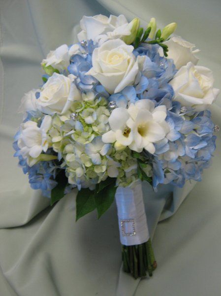 blue hydrangea wedding centerpieces | Blue hydrangea, white roses and fressia with crystals. Hydrangea Centerpiece Wedding, Blue Hydrangea Wedding, Blue Wedding Centerpieces, Hydrangea Bouquet Wedding, Wedding Flowers Hydrangea, Wholesale Flowers Wedding, Hydrangea Centerpiece, Blue And White Flowers, Hydrangea Bouquet