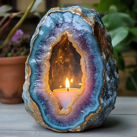 The Geode Candle is a stunning, nature-inspired piece that combines the beauty of crystals with the warmth of candlelight. Shaped like a real geode, the outer surface mimics the rugged texture of stone, while the inside reveals intricate, crystal-like formations that sparkle when illuminated. Hand-poured with premium, long-lasting wax, each candle boasts a unique, gemstone-like appearance, offering a blend of art and ambiance. As the candle burns, it casts a soft, radiant glow, creating a soo... Crystal Shaped Candles, Under Shelf Lighting, Geode Candle, Luxurious Candles, Rock Projects, Nightstand White, Textured Blankets, Decor Market, Stunning Nature