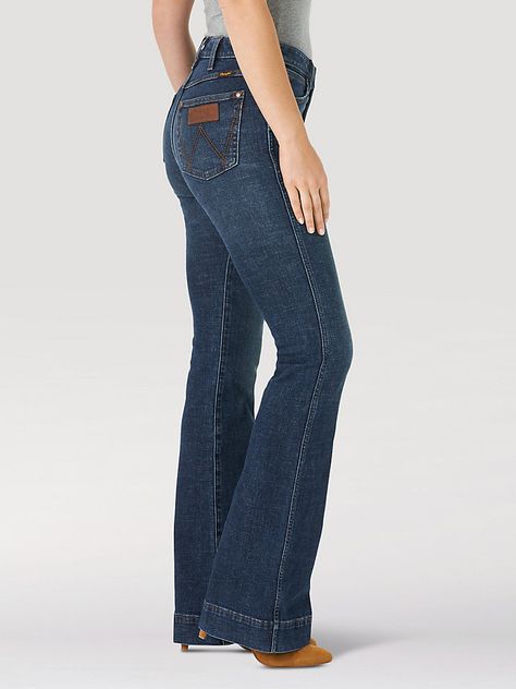 HAVE YOU MET BAILEY? Flattering from every angle, the Women’s Wrangler Retro® Bailey High Rise Trouser Jean is a best-kept secret for ladies who love volume. These denim trousers are crafted from a cotton blend with just a hint of stretch for all-day comfort. They come with a high-rise silhouette, a close fit through the thigh, and a 20.5” flared leg full of vintage vibes. Plus, the five-pocket styling, “W” pocket stitching, and logo patch bring an unmatched level of Western authenticity. George Strait Concert, Wrangler Jeans Women's, Womens Trouser Jeans, Wrangler Women, Pocket Stitching, Western Wear Outfits, Womens Work Boots, Western Jeans, Green Trousers