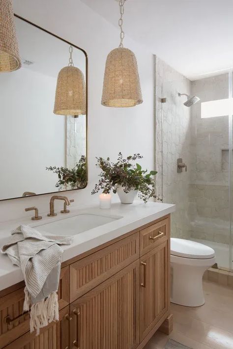 Woven light pendants and a double reeded wood vanity in a neutral bathroom space. Pendant Vanity Lights, Reeded Bathroom Vanity, Bathroom Vanity Pendant Lighting, Bathroom With Chandelier, Light Wood Bathroom Vanity, Reeded Wood, Natural Wood Bathroom Vanity, Basement Apartment Ideas, Penny Smith