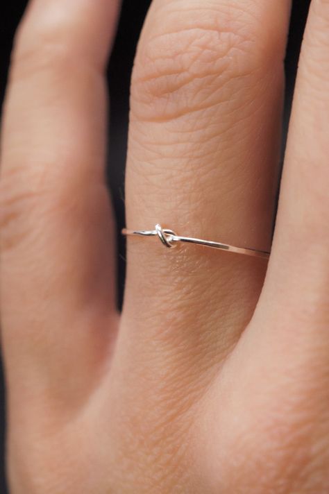 This stacking Knot ring is really cute and easy to wear! The closed wire knot adds a bit of extra detail to this otherwise simple hammered stacking ring. This is one single length of Sterling Silver metal that is knotted into a tight, closed knot and soldered around the back. This ring is a great alternative to a stacking ring! This listing is for ONE SINGLE RING. Each ring is made from STERLING SILVER. Choose from THIN (.7mm) or THICK (1mm) metal. NOTE: Due to the delicate nature of our Thin ri Minimal Rings Silver, Simple Ring Silver, Minimalist Rings Silver, Delicate Silver Jewelry, Silver Rings For Women Simple, Small Rings Simple, Cute Rings Silver, Simple Jewelry Silver, Rings Simple Silver