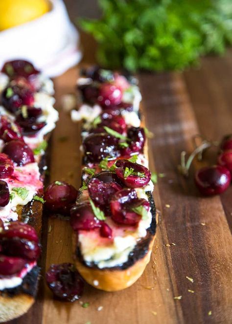 With this Summer’s amazing cherry bounty I figured a twist on the traditional bruschetta was in order. This Cherry Ricotta Bruschetta does not disappoint and is so easy for your next BBQ, picnic or party appetizer! keviniscooking.com Bruschetta With Ricotta Cheese, Cherry Crostini, Cherry Appetizers, Basil Blueberry Ricotta Bruschetta, Blueberry Lemon Ricotta Bruschetta, Bruschetta Recipe Cherry Tomatoes, Cherry Ricotta, Brushetta Appetizers, Herbed Ricotta Bruschetta