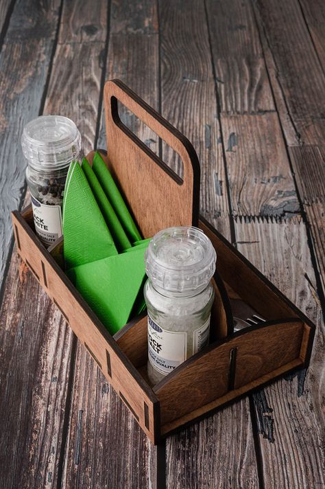 "Keep those condiments together using this table top bar caddy. Ideal for carrying to tables once food is ordered at the table, or at the bar! This caddy ca also be a perfect gift for a friend as a housewarming gift! For a nice way from kitchen to garden! Utensil Condiment Caddy Cutlery Organizer Wooden Cutlery Holder Product: * These custom utensil organizers are made of high quality natural plywood and might be laser engraved with your text or logo. * They are finished with different color oil Cutlery Holder Restaurant, Kitchen To Garden, Wooden Cutlery Holder, Table Top Organizer, Table Caddy, Cutlery Caddy, Cutlery Organizer, Wood Menu, Starting A Restaurant