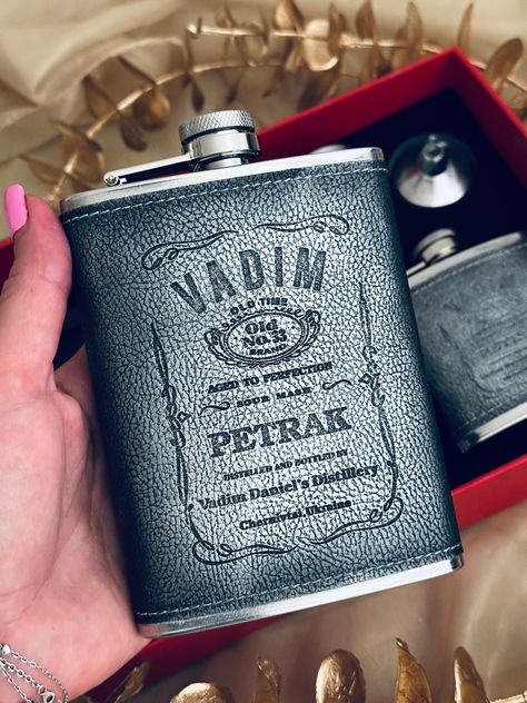 Personalized flask set for whiskey lovers ,Customized gift box with engraved flasks, Luxury leather bound Flask for Bachelor Party Idea, Leather Heavy Duty Hip 8oz , Flask Gift Set ,Gift for Men and Women ,Bachelorette Party Gift, Flasks for Men, Personalized Flask             We can engraved any text. Surprise your friend, brother, or father with this luxurious gift set they'll cherish for years to come. Our box includes an 8-ounce and a 6-ounce stainless steel flask, each wrapped in genuine leather with an elegant engraved label inspired by the classic style of Jack Daniel's whiskey. Additionally, the set comes with stainless steel shot glass and a deluxe pen to complete the look of a true gentleman. Choose any engraving and create a unique gift for any special occasion: birthday, bachel Whiskey Label Design, Flasks For Men, Personalized Flask, Whiskey Label, Engraved Flasks, Flask Set, Flask Gift, Personalized Flasks, S Monogram