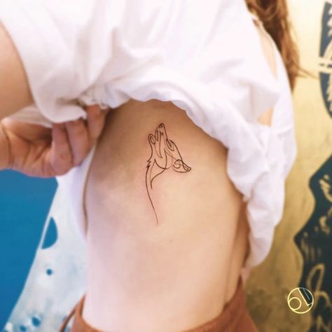 what is the meaning of a wolf tattoo? – neartattoos Mini Wolf Tattoo For Women, Outline Wolf Tattoo, Wolf Shoulder Tattoos For Women, Elegant Wolf Tattoo, Single Line Wolf Tattoo, Wolf Simple Tattoo, Tiny Wolf Tattoos For Women, Wolf Tattoo Linework, Wolf Outline Tattoo Simple