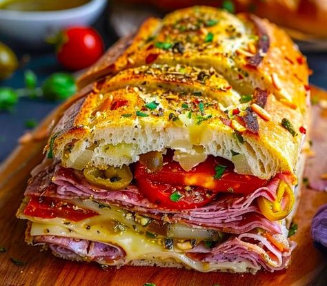 Classic Italian Muffuletta Sandwich Recipe - The Italian-American Page Muffaletta Bread, Muffaletta Recipe, Olive Salad Recipe, Muffaletta Sandwich, Muffuletta Sandwich, Italian Butter Cookies, Genoa Salami, Olive Salad, Sandwich Ingredients