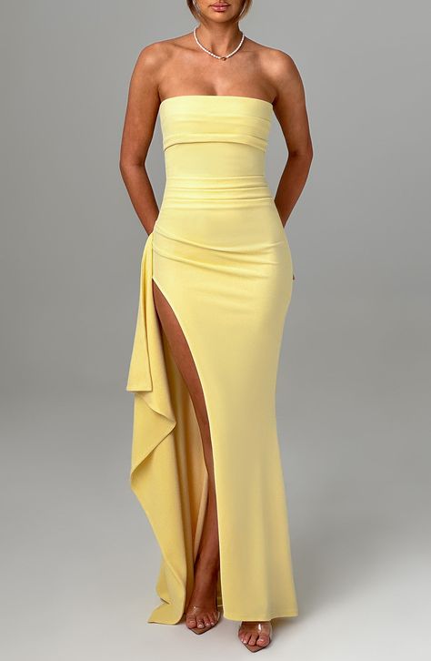 Be obsessed with Zafira, our timeless maxi made in luxury stretch crepe that moulds to your body for a heavenly fit. With a strapless neckline and pleated detailing, this showstopping look has a thigh high split and drape to one side.     Colour: Lemon.  Premium stretch crepe fabric.  Fully lined.  Strapless.  Pleated panel on bust.  Asymmetric pleats on waist.  Moulds to body figure.  Thigh high split.  Drape detail.  Invisible zipper to the reverse.  Maxi length.  Model is an XS and is wearing Yellow Formal Dresses, Yellow Prom Dresses, Yellow Prom Dress, Cute Formal Dresses, Split Long Dress, Yellow Dresses, Yellow Bridesmaid Dresses, Body Figure, Maxi Dress Sale