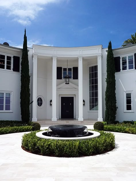 This custom made granite bowl fountain establishes a classic centerpiece at the entrance of a luxury home in Brentwood, CA. The fountain set inside a round basin enables water to fall all around in clear sheets, creating a grand first impression for the stately outdoor entrance. Fountain Entrance Home, Entry Fountain Entrance, Water Fountain Entrance Home, Luxury Front Yard Entrance, Entrance Fountain Ideas, Round Driveway Ideas Entrance, Fountain In Front Of House Entrance, Driveway Fountain Ideas, Mansions With Courtyards