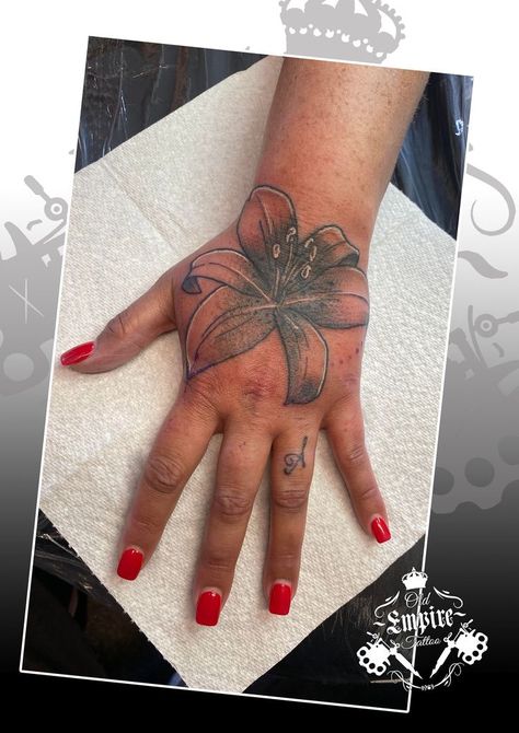 Loved doing this Lilly hand tattoo for our client 🌸😁 #lilly #Lillytattoo #oldempiretattoostudio #floraltattoo #blackandgreytattooartist #blackandgreyartist #blackandgreyink #manchester #tattooartist #tattoodesign #blackandgreytattoo #handtattoo Lilly Hand Tattoo, Lilly Tattoo, Lillies Tattoo, Empire Tattoo, Cute Simple Tattoos, Tattoo Henna, Hand Tattoo, Tattoo Ink, Simple Tattoo