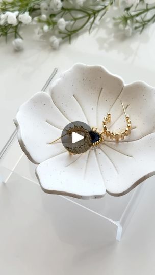 1.5K views · 17 reactions | Let’s make a flower trinket dish together 💕
Items used: 
• Flower Trinket Dish Cutter
• Gold Plated Flower Center Stamens (the bigger ones) 
• Needle Tool 
• Timber Hoops (in the last clip) also available in our shop! ☺️

The ceramic bowl I used is linked in my Amazоn Storefront in my biо 💕 It’s oven-safe so perfect to shape your trinket dishes. 

#polymerclayartist #polymerclay #trinketdish #ringdish #jewelry #jewelrydish #polymerclayearrings #polymerclaycreations | Tera Clay | ALTÉGO · Couldn't Care Less Polymer Clay Plate, Diy Clay Trinket Dish, Polymer Clay Trinket Dish, Flower Trinket Dish, Clay Jewellery Holder, How To Make Ceramic, Air Clay, Clay Plates, Jewellery Holder