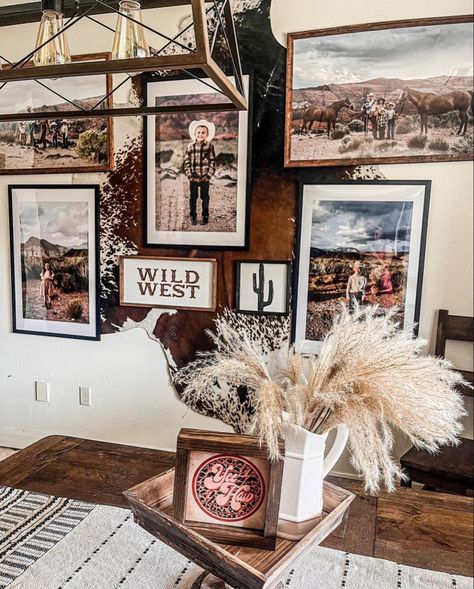 Boho Cowboy Living Room, Western Boho Fireplace Decor, Western Photo Wall Collage Living Room, Behind Couch Wall Decor Western, Cow Hyde On Wall, Cowhide Rug On Wall With Pictures, Decorating With Cowhide Rug On Wall, Western Picture Wall Ideas, Cowhide Picture Wall