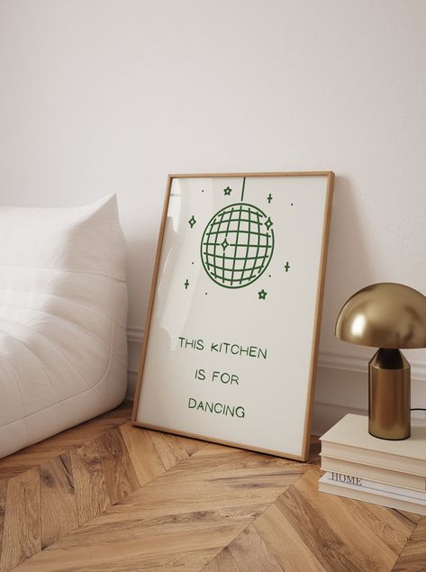 Add a playful touch to your kitchen decor with this trendy "Kitchen is for Dancing" poster. Featuring a whimsical disco ball illustration and the fun text "This kitchen is for dancing," this high-quality art print brings a lively and cheerful vibe to any cooking space. Perfect for those who love to dance while they cook, this poster serves as a joyful reminder to enjoy every moment in the kitchen. Its vibrant and engaging design makes it an excellent addition to your wall, creating an inviting and energetic atmosphere. This unique kitchen wall art also makes a fantastic gift for friends and family who share a love for food and dancing. Kitchen is for Dancing Poster, Trendy Kitchen Print, Cool Cute Cooking Kitchen Art Print, Kitchen Wall Poster, High Quality Print, Disco Ball Kitchen Poster This Kitchen Is For Dancing Poster, This Kitchen Is For Dancing, Green Disco Ball, Disco Ball Illustration, Cooking Poster, Fun Kitchen Decor, Ball Illustration, Cool Illustration, Kitchen Is For Dancing