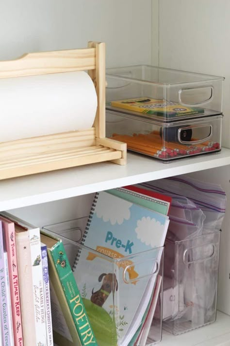 School Bookshelf Organization, Homeschool Cabinet Dining Room, Homeschool Preschool Organization, Homeschool Materials Organization, Billy Bookcase Homeschool, Homeschool In Kitchen Ideas, Curriculum Storage Ideas, Playroom Next To Kitchen, Homeschool Storage Dining Room