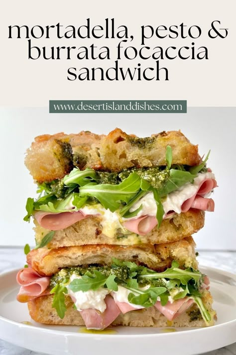 This easy focaccia sandwich has crisp pesto focaccia, pesto, burrata, mortadella, rocket and a homemade garlic confit aioli. Pesto Focaccia Sandwich, Sandwiches Birthday Party, Focaccia Panini Sandwiches, Pesto Sourdough Sandwich, Best Deli Sandwiches, Faccocia Sandwich, Focaccia Sandwich Recipes, Italian Focaccia Sandwich, Mortadella Sandwich Recipes