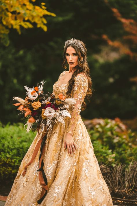 You'll want to take your time with these halloween wedding details -- a custommade gold wedding dress, chic skull decor, and wedding dogs dressed to match the couple! Brown Gold Wedding Dress, Gold Wedding Gown, Wedding Dress With Gold Accents, Prom Dresses Gold, Golden Wedding Dress, Gold Glitter Dress, Gold Wedding Gowns, Dog Wedding Dress, Golden Gown