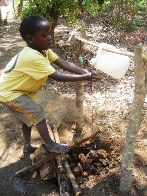 Intoducing tippy tap…a hands free way to wash your hands that is especially appropriate where there is no running water or where there is limited handwashing facilities. It is operated by a foot lever and thus reduces the chance for bacteria transmission.    Go Tippy Tap!!!    © UNICEF/Zambia/2012/Asindua    Learn more: http://www.unicef.org/wash/index_43107.html Tippy Tap, Water Sanitation, Mud Kitchens, California Drought, Stealth Camping, Give Peace A Chance, Fresh Perspective, Mud Kitchen, Small Steps