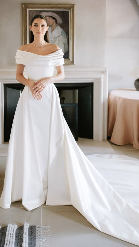 Silk Wedding Dress With Bow, Off Shoulder Puff Sleeve Wedding Dress, Elizabeth James Wedding Dress, Minimalist Wedding Dresses Reformation, Minimalist Wedding Dresses With Bow, Kelsey Kreppel Wedding Dress, Greek Inspired Dress, Structured Wedding Dress With Bow, Donna Suits