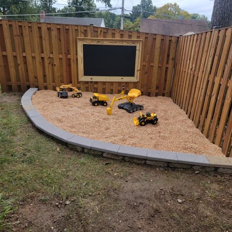 Outdoor gravel play area Patio And Play Area Backyard Ideas, Outdoor Kids Play Area Diy, Play Areas For Kids Outdoor, Backyard Construction Play Area, Corner Play Area Outdoor, Boys Outdoor Play Area, Back Yard Kid Friendly Ideas Diy, Dirt Pit For Kids Outdoor Play, Backyard Digging Area