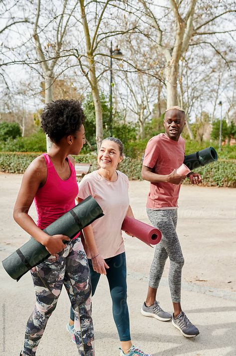 Diverse group of fit friends in sportswear talking together while walking along a path in a park after an outdoor yoga class Yoga In The Park, Cloud Shoot, Friends Walking Together, Outdoor Event Ideas, Walking Group, Start Yoga, Fitness Friends, Yoga Friends, Home Workout Men