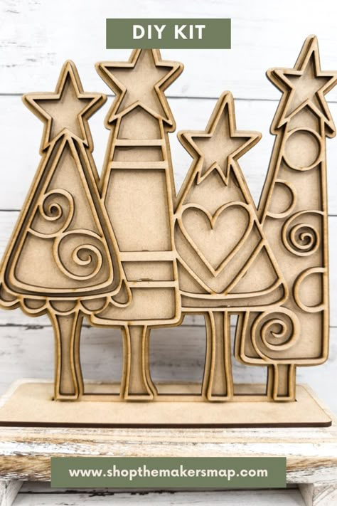 Create a stained glass effect with this DIY Craft Kit for Christmas! The whimsical ornate Christmas trees are wood blank pieces that you decorate and assemble to match your own personal style this Christmas Lazer Christmas Ideas, Christmas Crafts From Scrap Wood, Mdf Diy Ideas, Christmas Wood Decorations, Laser Cut Christmas Decorations, Christmas Wood Craft, Wood Christmas Trees Diy, Lasercut Ideas, Laser Cut Wood Jewelry