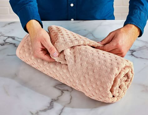 Folding Towels For Storage, How To Fold Towels Into Rolls, How To Roll A Towel Bathroom Storage, Fancy Fold Towels, How To Roll Bath Sheets, Bath Towel Roll, Guest Room Towel Ideas, Roll A Towel Like A Hotel, How To Fold Towels For Airbnb