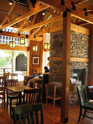 Caribou Coffee interiors | b.lush; fireplace, wood, lighting, small tables & chairs (like the checker board, honestly!) Fireplace In Coffee Shop, Caribou Coffee Aesthetic, Coffee Recepies, Dairy Free Coffee, Wood Lighting, Coffee Tumblr, Fireplace Wood, Caribou Coffee, Coffee In Bed