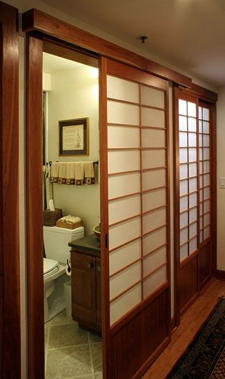 Four shoji screens line this hallway in a complicated overlay of tracking installations. Great care was taken to keep all the horizontal elements in line when working out the shoji sizes. Shoji Screen Doors, Shoji Sliding Doors, Japanese Sliding Doors, Japanese Bathroom Design, Shoji Doors, Japanese House Design, Japanese Door, Japanese Bathroom, Japanese Home Design