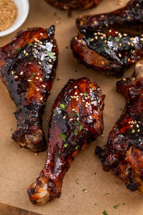 These sweet & sticky baked chicken drumsticks are the perfect appetizer or easy dinner! Tender chicken legs are coated in a sticky, addictive glaze packed with Asian flavors and baked until juicy. These are absolutely the BEST baked drumsticks! How Long To Bake Chicken Drumsticks, Japanese Chicken Drumsticks, Asian Drumsticks Baked, Slow Cooked Chicken Drumsticks, Chicken Legs And Wings Recipes, Marinade For Chicken Legs On The Grill, Chicken Legs Air Fryer Recipes, Korean Drumsticks Recipe, Sheet Pan Drumsticks