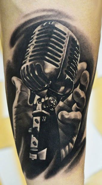 Love it! On my inside forearm without the hand. I want a quote with it. Maybe " I haven't understood a bar of music my whole life, but I have felt it" because i sing and play by ear. Never learned to read music. Mic Tattoo, Rockabilly Tattoos, Microphone Tattoo, Alas Tattoo, Music Tattoo Sleeves, Music Notes Tattoo, Guitar Tattoo, Music Tattoo Designs, Note Tattoo