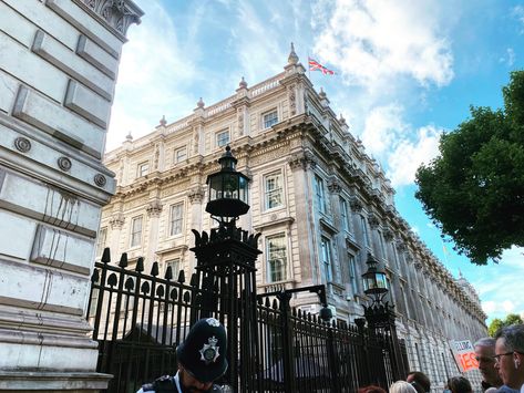 Blue sky behind beautiful buildings. Large black gate at the entrance of Downing Street Downing Street, London Travel, London City, Big Ben, Gate, Louvre, London, Architecture, Building