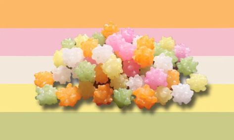 A pastel colored flag with a PNG of konpeito candy on top. The colors go in order of orange, pink, white, yellow, and green. Candy Xenogender, Pastel Stars, Japanese Candy, Yokai Watch, Pride Flags, Splatoon, Star Shape, Monster High, The Star