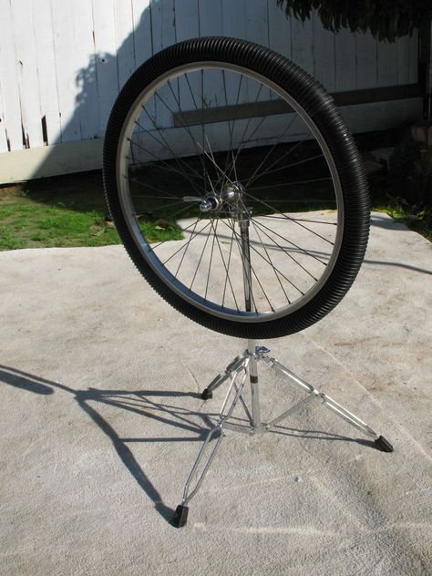 This "Rain Wheel" is a corrugated hose filled with rocks, beans, BBs, etc., and attached to a bicycle rim with zip ties. Can be mounted on a fence or wall as part of an outdoor music area. Outdoor Music Area, Music Garden, Rain Sticks, Homemade Instruments, Homeschool Music, Diy Instruments, Outdoor Music, Sensory Garden, Diy Musical Instruments