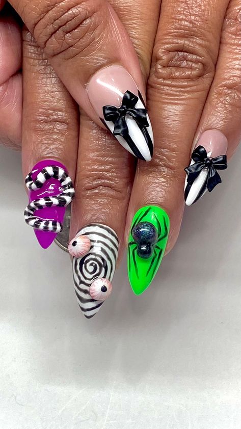 🎃 Invoke the whimsical yet spooky spirit of the iconic ghost with our Beetlejuice Inspired Halloween Gel Press On Nails. Perfect for Halloween enthusiasts and fans of the classic film, these press-on nails are designed with the distinctive black and white stripes and eerie green accents reminiscent of Beetlejuice's unforgettable suit. Whether you're attending a Halloween party, engaging in cosplay, or simply celebrating the season, these nails add a playful yet eerie touch to any costume. 👻 Key Features: 🖤 Beetlejuice-Themed Design: Each nail features bold black and white stripes with splashes of ghostly green, capturing the essence of the film's main character. 📏 Versatile Size Options: Available from extra short to long, ensuring a perfect fit for all nail types and preferences. ✨ Hi Halloween Nail Designs Green And Black, 3d Beetlejuice Nails, Nail Art Themes Ideas, Halloween Characters Nails, Beetlejuice Nails Coffin, Beetlejuice Short Nails, Extra Halloween Nails, Halloween Nails Long Square, Short Beetlejuice Nails